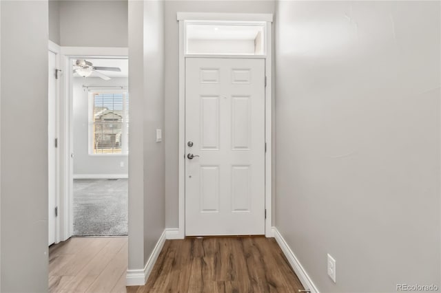 doorway featuring ceiling fan and wood-type flooring