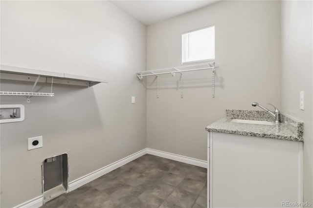 washroom with hookup for an electric dryer, sink, and washer hookup