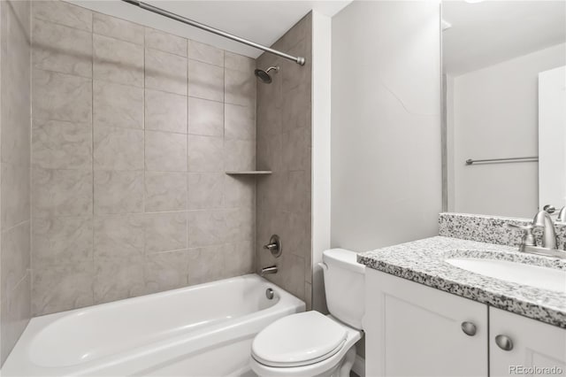 full bathroom with tiled shower / bath combo, vanity, and toilet