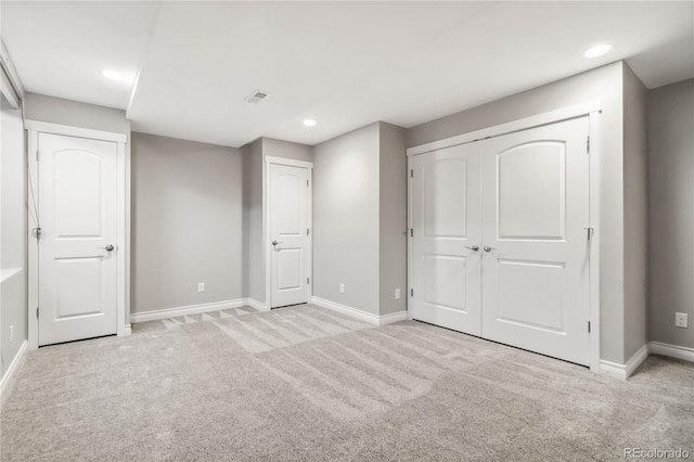 unfurnished bedroom with light carpet