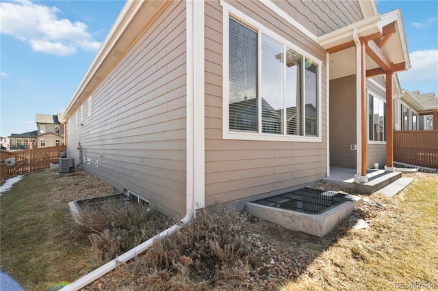 view of side of home featuring cooling unit