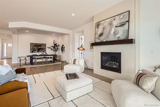 668 Leafy Aster Ln, Castle Rock, CO 80104 - living area featuring wood finished floors, a fireplace, and recessed lighting