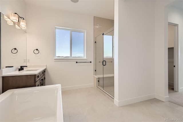 668 Leafy Aster Ln, Castle Rock, CO 80104 - full bathroom with a shower stall, a freestanding bath, vanity, baseboards, and a walk in closet
