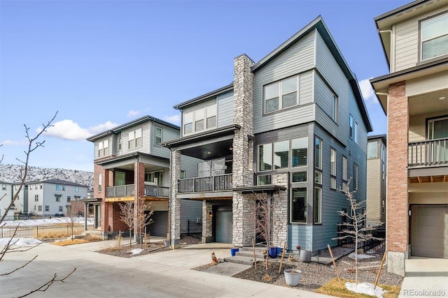 view of front of property with a garage and a balcony