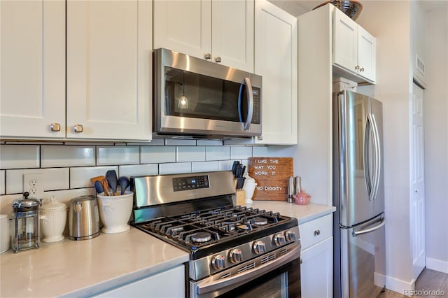 1739 E Martin Luther King Jr Blvd, Denver, CO 80205 - kitchen with stainless steel appliances, white cabinets, and light countertops