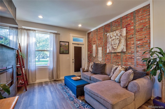 1739 E Martin Luther King Jr Blvd, Denver, CO 80205 - living area with wood finished floors, recessed lighting, brick wall, and ornamental molding
