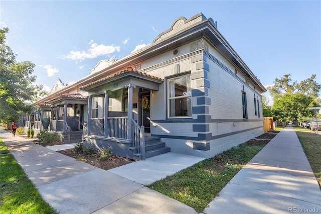 1739 E Martin Luther King Jr Blvd, Denver, CO 80205 - view of front of house with a porch and brick siding
