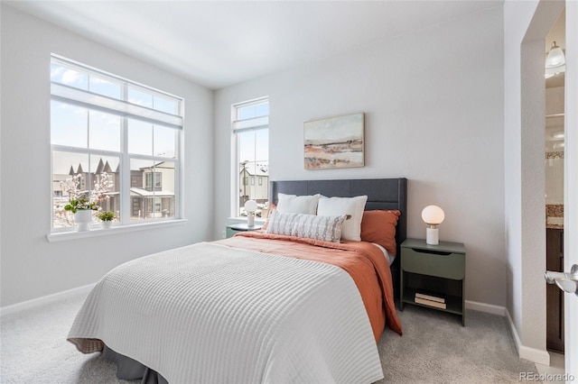 bedroom featuring light colored carpet