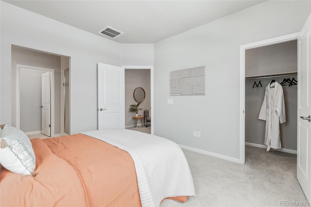 bedroom featuring light carpet and a closet