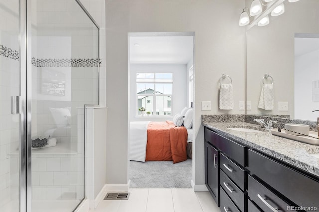 bathroom featuring vanity, walk in shower, and tile patterned flooring