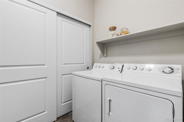 washroom featuring washing machine and dryer