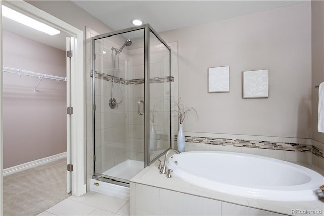 bathroom with tile patterned floors and plus walk in shower