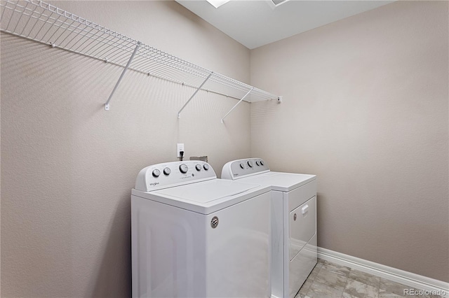 laundry area featuring separate washer and dryer