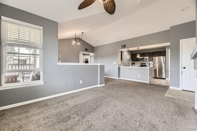 12824 Ironstone Way Unit 303, Parker, CO 80134 - unfurnished living room featuring light colored carpet, a ceiling fan, lofted ceiling, and a chandelier