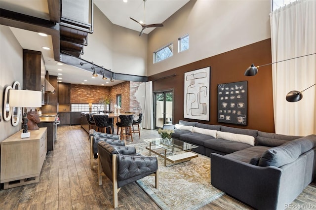 114 El Paso Blvd, Manitou Springs, CO 80829 - living area with hardwood / wood-style flooring, a high ceiling, and recessed lighting