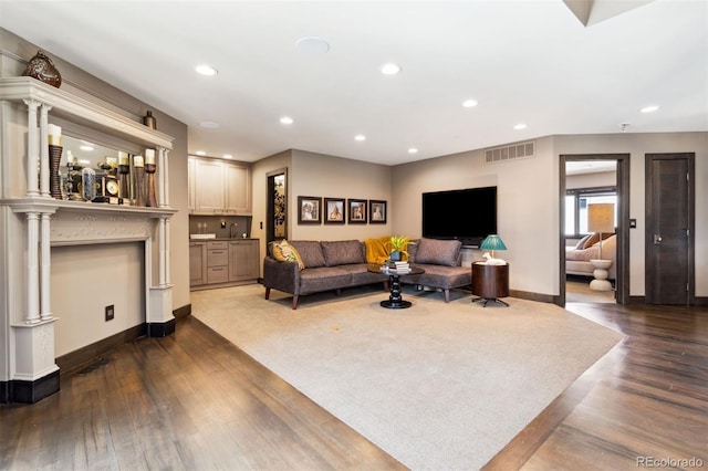 114 El Paso Blvd, Manitou Springs, CO 80829 - living room featuring recessed lighting, dark wood-style floors, and decorative columns