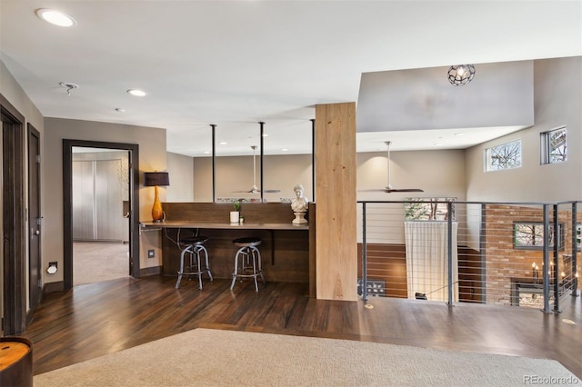 114 El Paso Blvd, Manitou Springs, CO 80829 - kitchen featuring wood finished floors, a breakfast bar area, and recessed lighting