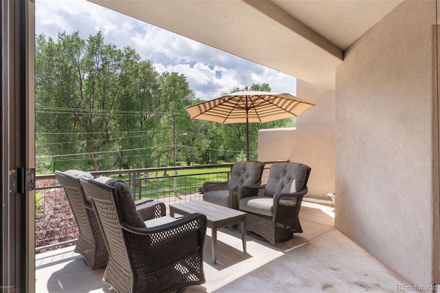 114 El Paso Blvd, Manitou Springs, CO 80829 - patio / terrace with an outdoor living space and view of wooded area