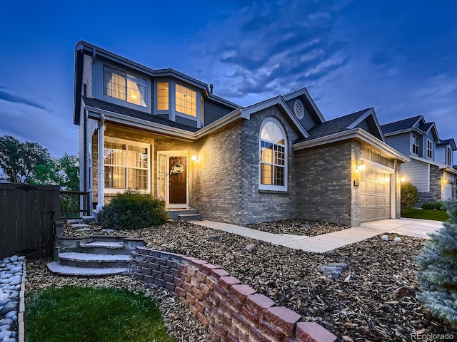 9412 Burgundy Cir, Highlands Ranch, CO 80126 - traditional home featuring brick siding, an attached garage, and concrete driveway