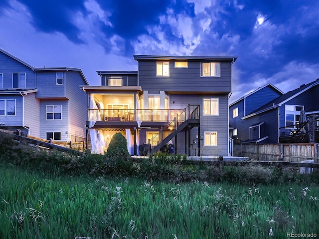 9412 Burgundy Cir, Highlands Ranch, CO 80126 - rear view of house featuring stairs and a deck