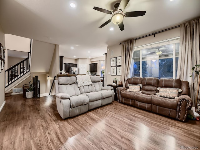 9412 Burgundy Cir, Highlands Ranch, CO 80126 - living room featuring ceiling fan, wood finished floors, stairs, and recessed lighting