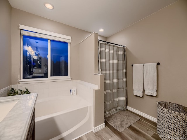9412 Burgundy Cir, Highlands Ranch, CO 80126 - bathroom featuring wood finished floors, a bath, recessed lighting, curtained shower, and vanity