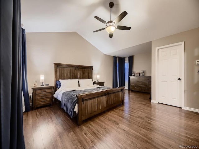 9412 Burgundy Cir, Highlands Ranch, CO 80126 - bedroom featuring wood finished floors, vaulted ceiling, and ceiling fan