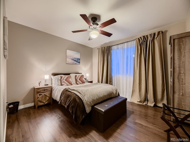 9412 Burgundy Cir, Highlands Ranch, CO 80126 - bedroom with dark wood finished floors and a ceiling fan