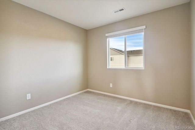 spare room with carpet floors