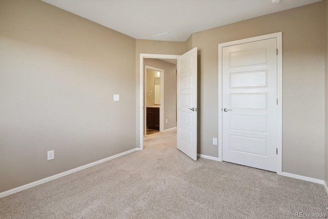 unfurnished bedroom featuring light colored carpet