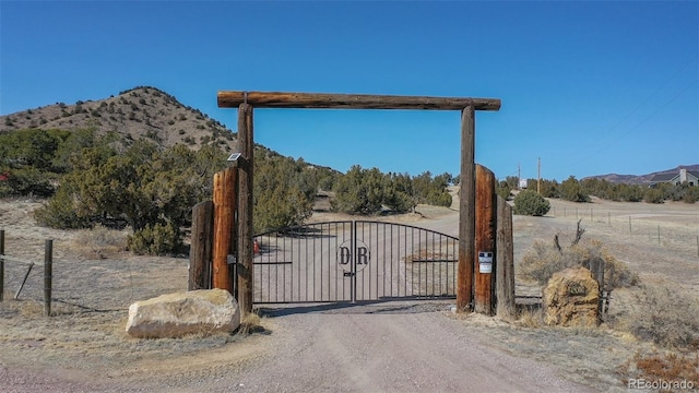 view of gate featuring a mountain view