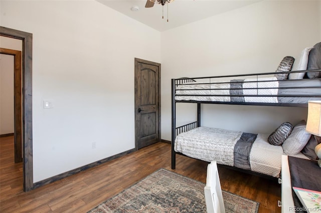 bedroom featuring ceiling fan and dark wood-type flooring