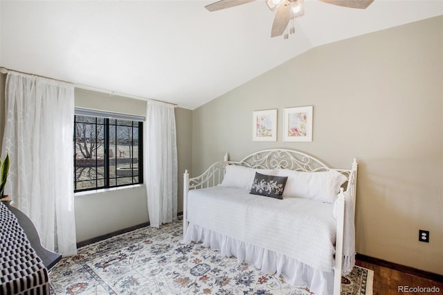 bedroom with lofted ceiling and ceiling fan