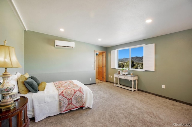 bedroom featuring light carpet and a wall unit AC