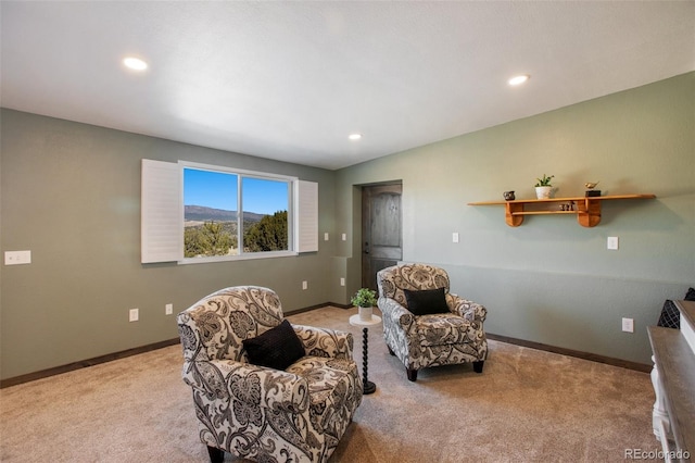 sitting room with light colored carpet