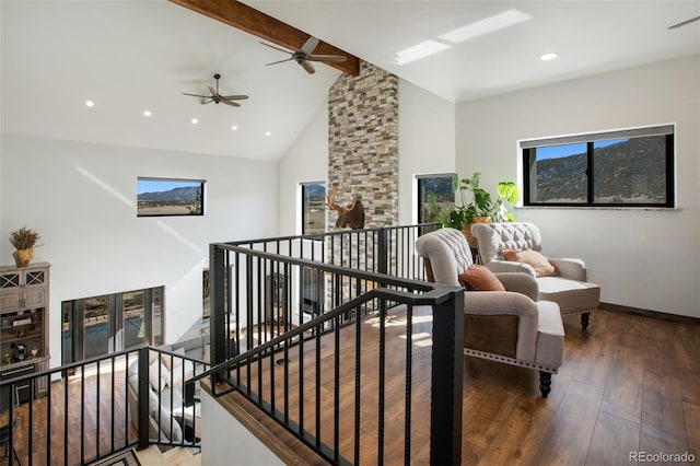 interior space featuring beam ceiling, ceiling fan, high vaulted ceiling, and dark hardwood / wood-style flooring