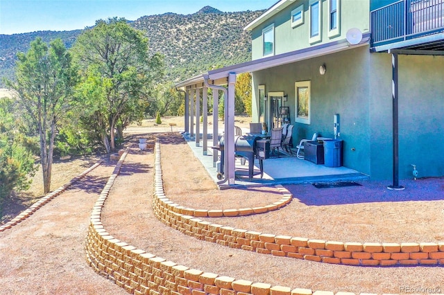 view of patio featuring a mountain view