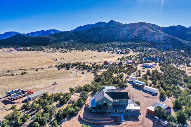 drone / aerial view featuring a mountain view