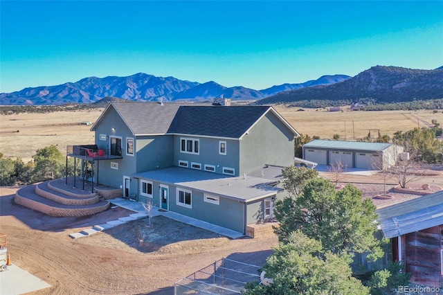 birds eye view of property featuring a mountain view