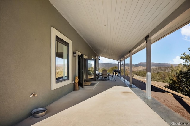 view of patio / terrace featuring a grill and a mountain view