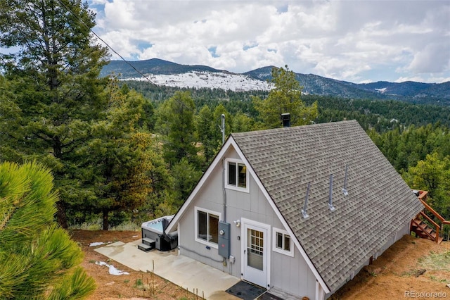 44 El Paso Ct, Cripple Creek, CO 80813 - view of subject property with a heavily wooded area and a mountain backdrop