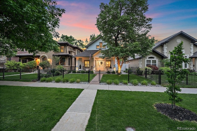 2340 S Columbine St, Denver, CO 80210 - view of front of home with stucco siding and a fenced front yard