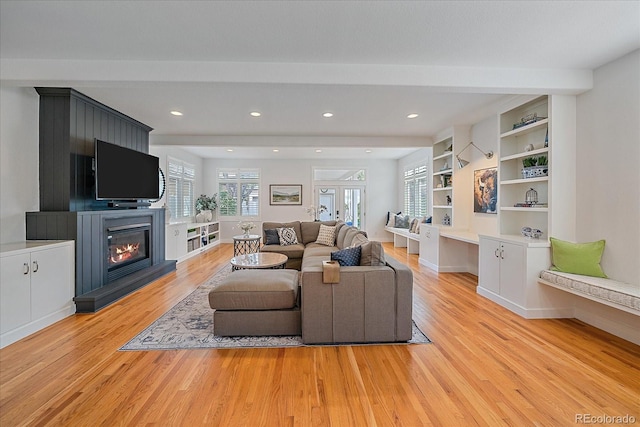 2340 S Columbine St, Denver, CO 80210 - living room with light wood finished floors, a glass covered fireplace, and recessed lighting