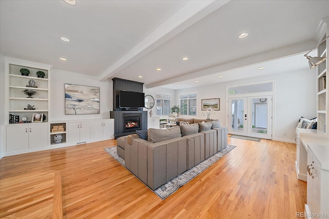 2340 S Columbine St, Denver, CO 80210 - living room with recessed lighting, beam ceiling, light wood-style floors, a fireplace, and french doors