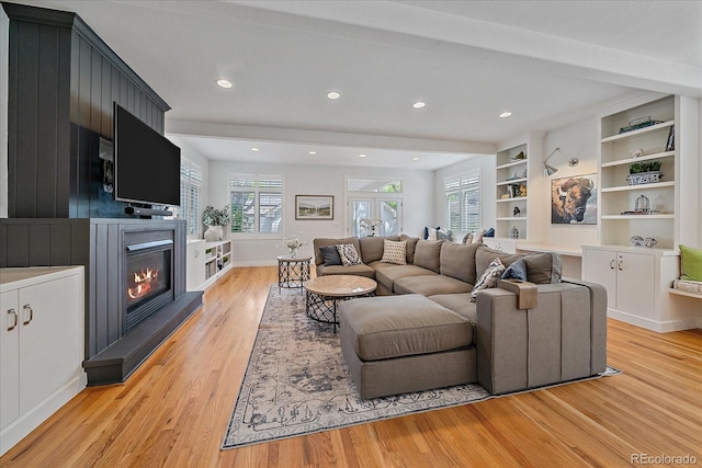 2340 S Columbine St, Denver, CO 80210 - living room featuring light wood-style flooring, healthy amount of natural light, a glass covered fireplace, and recessed lighting