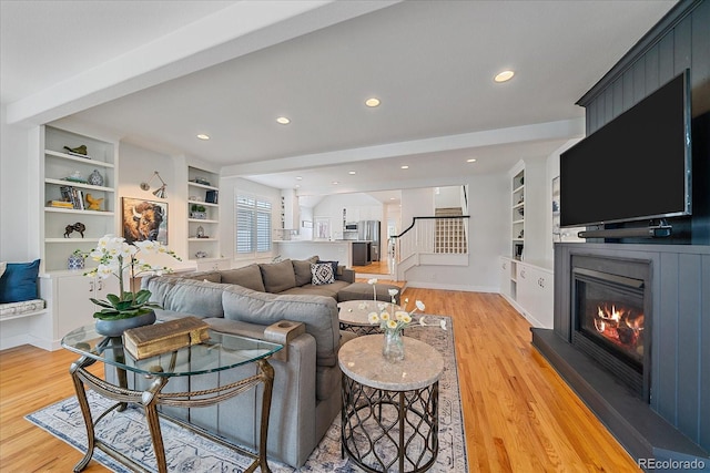 2340 S Columbine St, Denver, CO 80210 - living area with light wood-type flooring, a fireplace, built in shelves, stairway, and recessed lighting