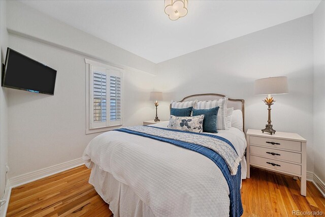 2340 S Columbine St, Denver, CO 80210 - bedroom featuring wood finished floors and baseboards