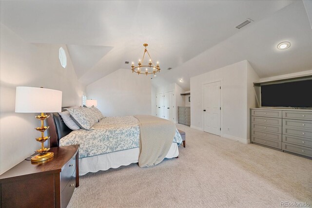 2340 S Columbine St, Denver, CO 80210 - carpeted bedroom with vaulted ceiling, a chandelier, and two closets