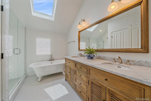 2340 S Columbine St, Denver, CO 80210 - full bathroom featuring a skylight, vaulted ceiling, a stall shower, a freestanding tub, and double vanity