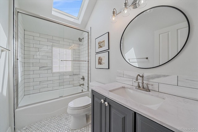 2340 S Columbine St, Denver, CO 80210 - bathroom with vanity, enclosed tub / shower combo, a skylight, and tile patterned floors